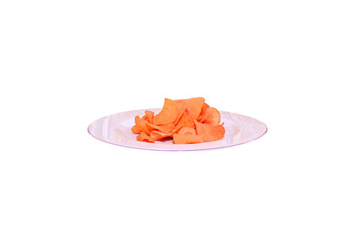 Crispy orange potato chips served on white plate isolated on transparent background