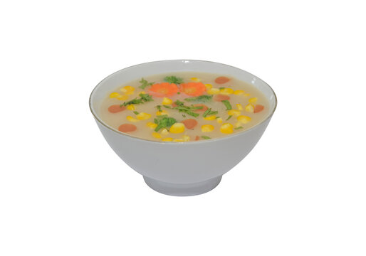 Warm vegetable corn soup served in white ceramic bowl isolated on transparent background