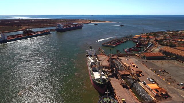 Ships being loaded with resources for international shipping Port Heldand
