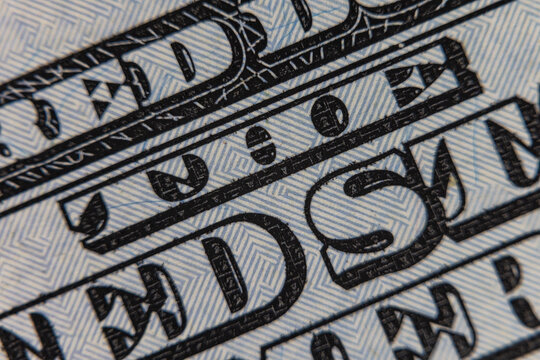 Extreme macro close up of microprinting typography and security pattern on US dollar banknote