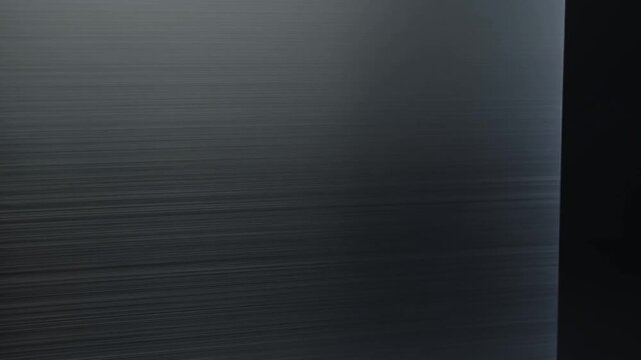 Brushed Metal Surface with Soft Light and Dark Edge in Industrial Setting