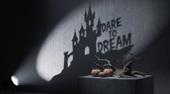 Halloween shadow projection of a haunted castle with Dare to Dream text on a dark wall.
