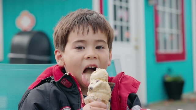 Asian Boy Eating Ice Cream Cone