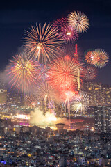 Obraz premium Celebration. Aerial view of skyline with fireworks light up sky over Ho Chi Minh City ( Saigon ), Vietnam. Beautiful night view cityscape.