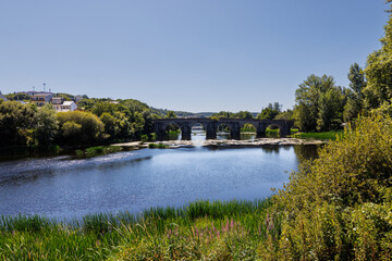 Fototapeta premium Ancient Roman stone bridge over Minho River in Lugo, Galicia,Spain