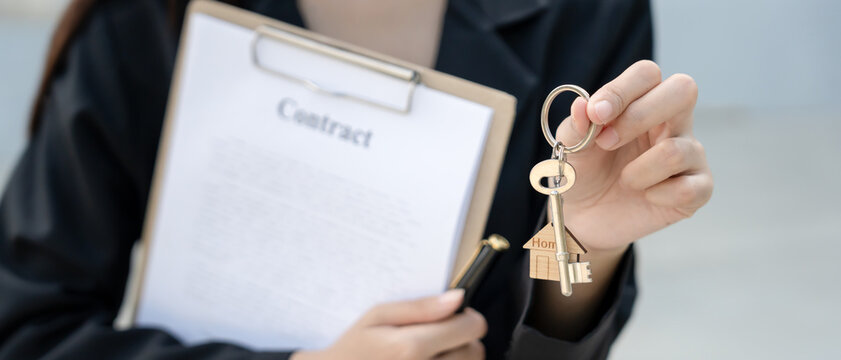 lease, rental and selling home. Real estate agent hold key for new house or real estate. rent house, Sales, loan credit financial, insurance, Seller, dealer, installment,  buy, sell, move in