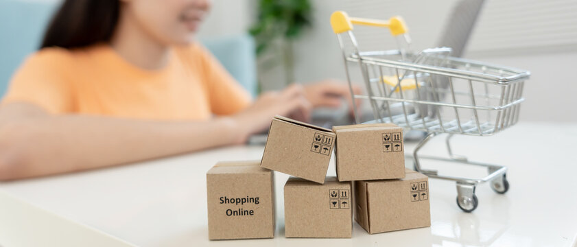 woman using laptop for online shopping at home. Hand holding mobile phone with payment detail page display and credit card, stay home, technology, electronic commerce, internet, market place