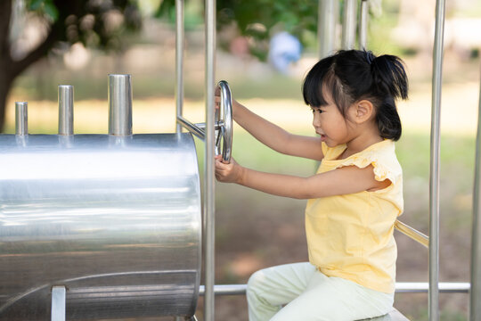 Asian children play in a park on a playground summer day. children playground in a public park, entertainment and recreation for children, holiday, IQ, EQ, Relax, Development