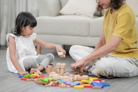 Mother day, Happy mother playing  with the little girl. Funny family is happy and excited in the house. mother and daughter have fun spending time together. holiday, weekend, IQ, EQ, meditation