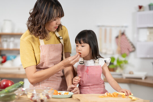activities together during the holidays. mother and daughter are having a meal together, Mother prepare breakfast for daughter on morning, enjoy, weekend, vacant, family time, mother day