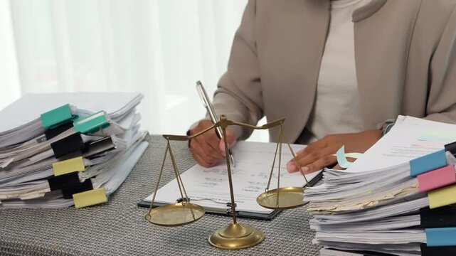 Legal Professional Signing Contract Documents in Law Office