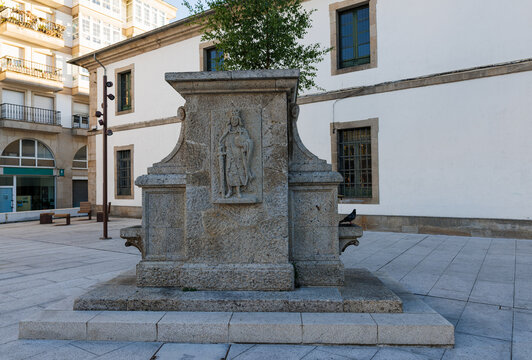 Historic stone fountain in Praza de Ferrol public square in Lugo Spain