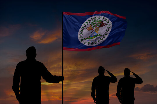 Military mans holds in their hands National flag of Belize