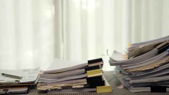 Stacks of Paper Documents and Administrative Files in Home Workspace