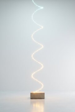 Zigzagging 3D light thread rises from a stone block