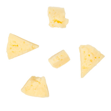 Pieces of yellow cheese arranged on a white background, showcasing various shapes and textures, ideal for culinary presentations and food-related designs