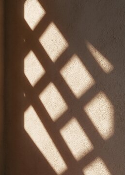 Close-up of a wall with a diagonal pattern of light rays shining through it. the light rays are arranged in a grid-like pattern, creating a shadow on the wall.