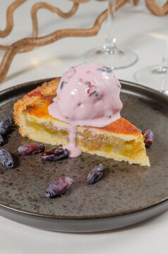 Close-Up of Rhubarb Pie Slice with Berry Ice Cream and Honeyberries