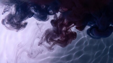 Obraz premium Dark blue and purple ink diffusing in clear water creating abstract liquid smoke patterns