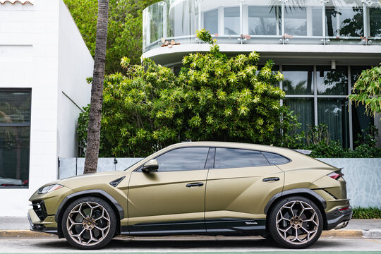 Miami, Florida, USA - May 11, 2025: Luxury SUV Lamborghini Urus. Car Lamborghini Urus parked outdoor. Matte bronze car, side view. Lamborghini Urus 2024 luxury SUV car.