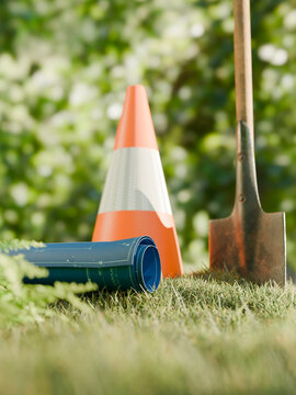 Construction site preparation with blueprints and shovel on green belt land