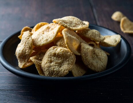 Traditional Homemade Sugar Cookies on a Black Ceramic Plate