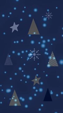 Animation of snow falling over christmas trees and stars in winter scenery