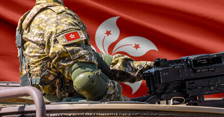Naklejka premium Hong Kong national flag with soldier at machinegun turret