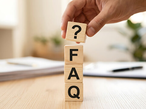 Hand stacking wooden blocks with faq