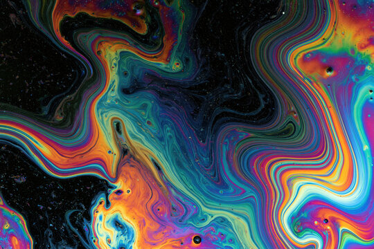 Abstract swirling colors resembling an oil slick on water, with vibrant iridescent hues and dark undertones. The patterns flow and blend, creating a mesmerizing. , AI generative
