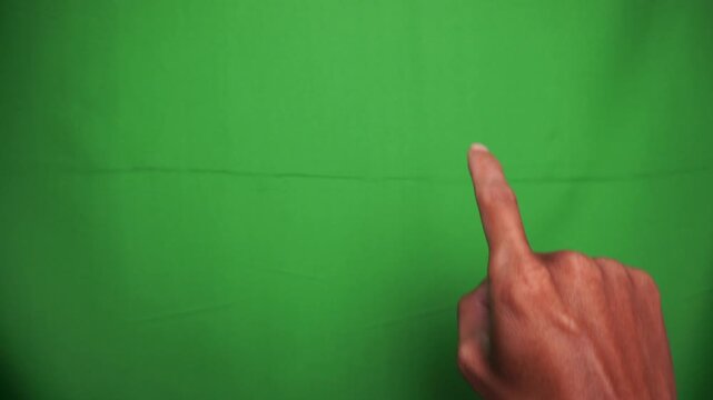 Hand Pointing Upward with One Finger Against a Green Screen Background