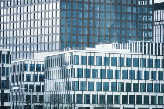 View of modern office buildings with glass facades and geometric grid patterns in Poznan, Greater Poland Voivod, Poland.