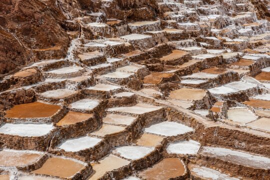 Terraced salt evaporation pans stepping down a hillside