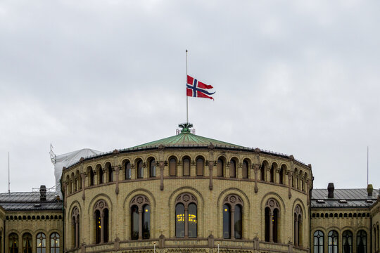 Norwegian flag flying half-mast over Stortinget showing national mourning