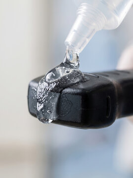 Squeezing Clear Ultrasound Transmission Gel onto Medical Transducer Probe