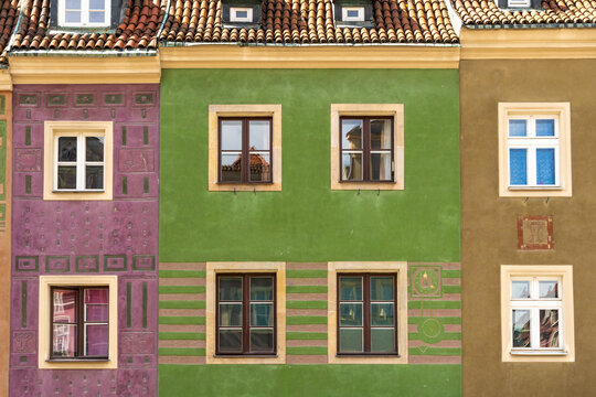 View of colorful historic merchant house facades with decorative patterns and windows in the Old Market Square in Poznan, Greater Poland, Poland.