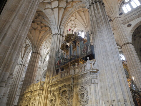 View of the ornate pipe organ and intricate Gothic vaulted ceilings inside the historic Salamanca Cathedral in Salamanca, Castile and Leon, Spain.