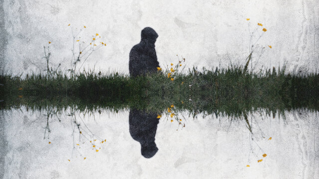 A strange mirrored blurred edit of a spooky mysterious hooded figure standing in a field. With a grunge minimal edit.