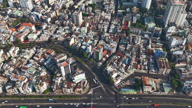 High-angle aerial view of dense urban housing in District 5 along Vo Van Kiet Boulevard, Ho Chi Minh City, Vietnam
