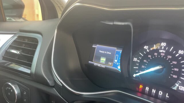 Dashboard of a car featuring a readiness notification on the display, with a clear view of the speedometer and gear indicator, emphasizing the vehicle's operational readiness in a modern interior. 4k