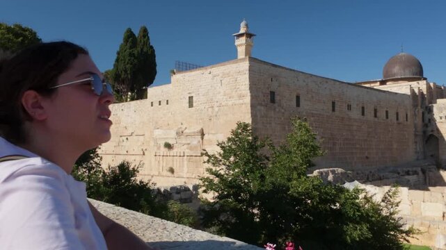Young female tourist admiring the al aqsa mosque in jerusalem
