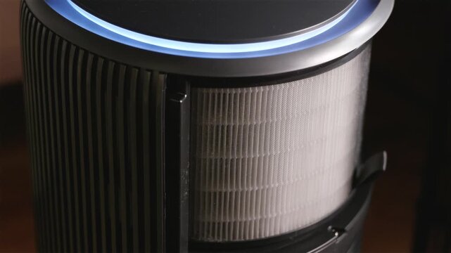 Angle view replacing paper filter in smart air purifier