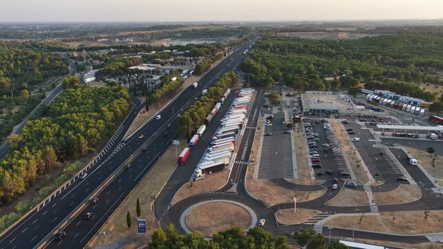 Villetelle, France - July 25, 2026: aerial view of the Fastned charging station at A9 Aire d'Ambrussum Nord service area with parking area and motorway infrastructure
