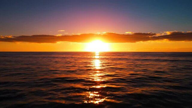 Mesmerizing sunset illuminating ocean waters with radiant golden light and sky&acirc;&euro;TMs colorful reflections