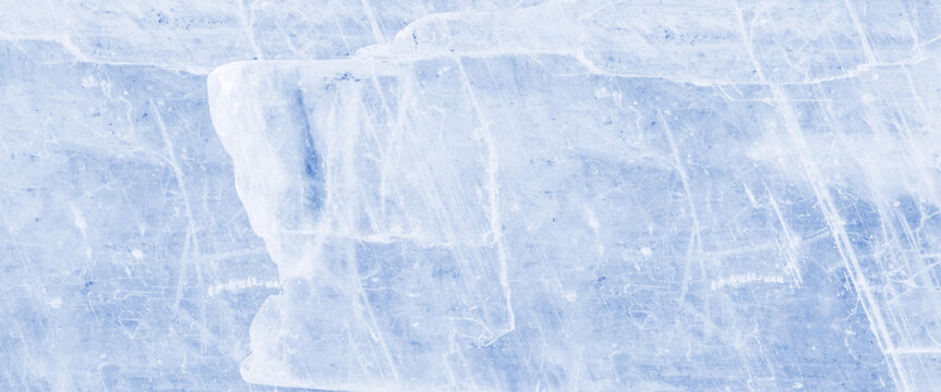Close up macro texture of cracked light blue solid ice surface background