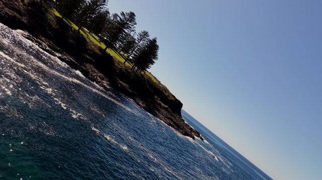 Aerial Cinematic Barrel Roll Toward Kiama Blowhole on Dramatic NSW South Coast