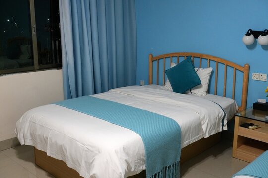Basic hotel room in a guesthouse in rural Guangdong, China. Generic interior.