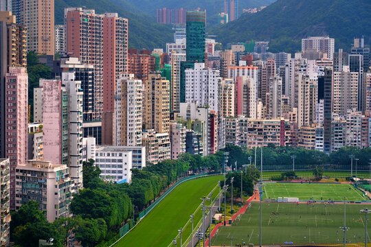 Hong Kong big city residential skyline with Happy Valley neighborhood of Wan Chai District in Hong Kong. Sport fields and racecourse.