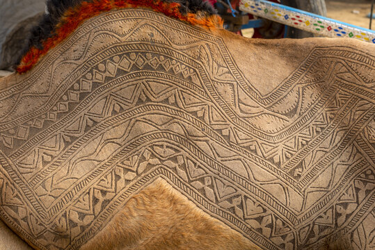 View of intricate geometric camel skin carving with traditional patterns on the hide of a camel in Bahawalpur, Punjab, Pakistan.