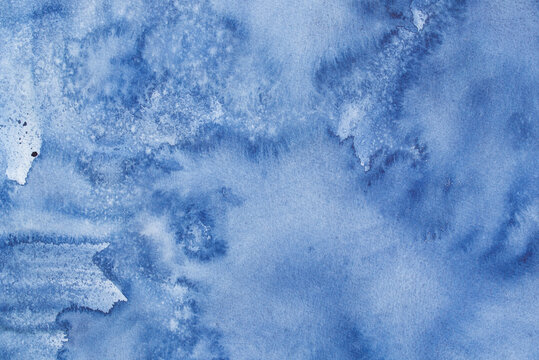 blue watercolor background painted on paper texture